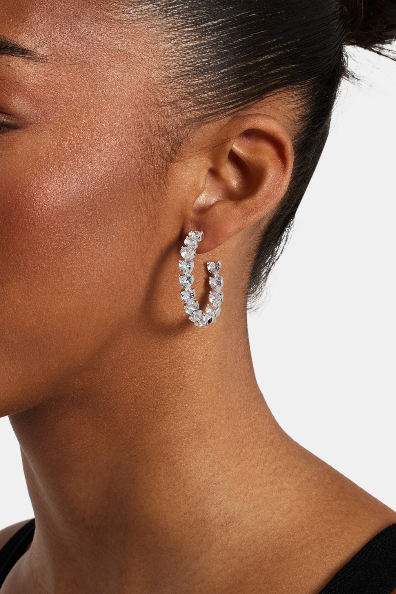 female model wearing Iced heart hoop earring